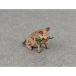 An Austrian miniature cold painted bronze of a pig with four leaf clover in his mouth, probably