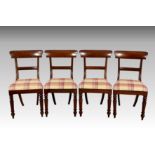 A set of four early Victorian mahogany dining chairs, with flared label top rails and bar backs over