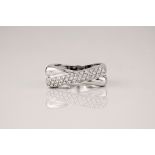 A platinum and diamond crossover ring, the polished platinum band flattening into a square top,