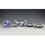 An English 18th century blue and white porcelain teapot, tea bowls and saucers, probably Thomas