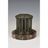 A very unusual antique patinated bronze pen/quill stand in the form of a circular columned "