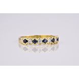 An 18ct yellow gold, sapphire and diamond half eternity ring, with alternate round cut sapphires and