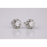 A pair of white gold and diamond ear studs, each diamond weighing approximately 0.15ct each and held