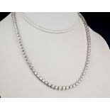 A fine 18ct white gold and diamond graduated line necklace, the brilliant cut diamonds totalling