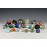 A collection of various glass paperweights, to include a clear glass teardrop example, etched with a