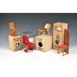 Four Vitra Design Museum miniature furniture models, 1/6 scale, comprising a Charles & Ray Eames LCW