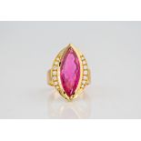 A marquise cut pink tourmaline and diamond 18ct yellow gold ring., A pink tourmaline in a diamond