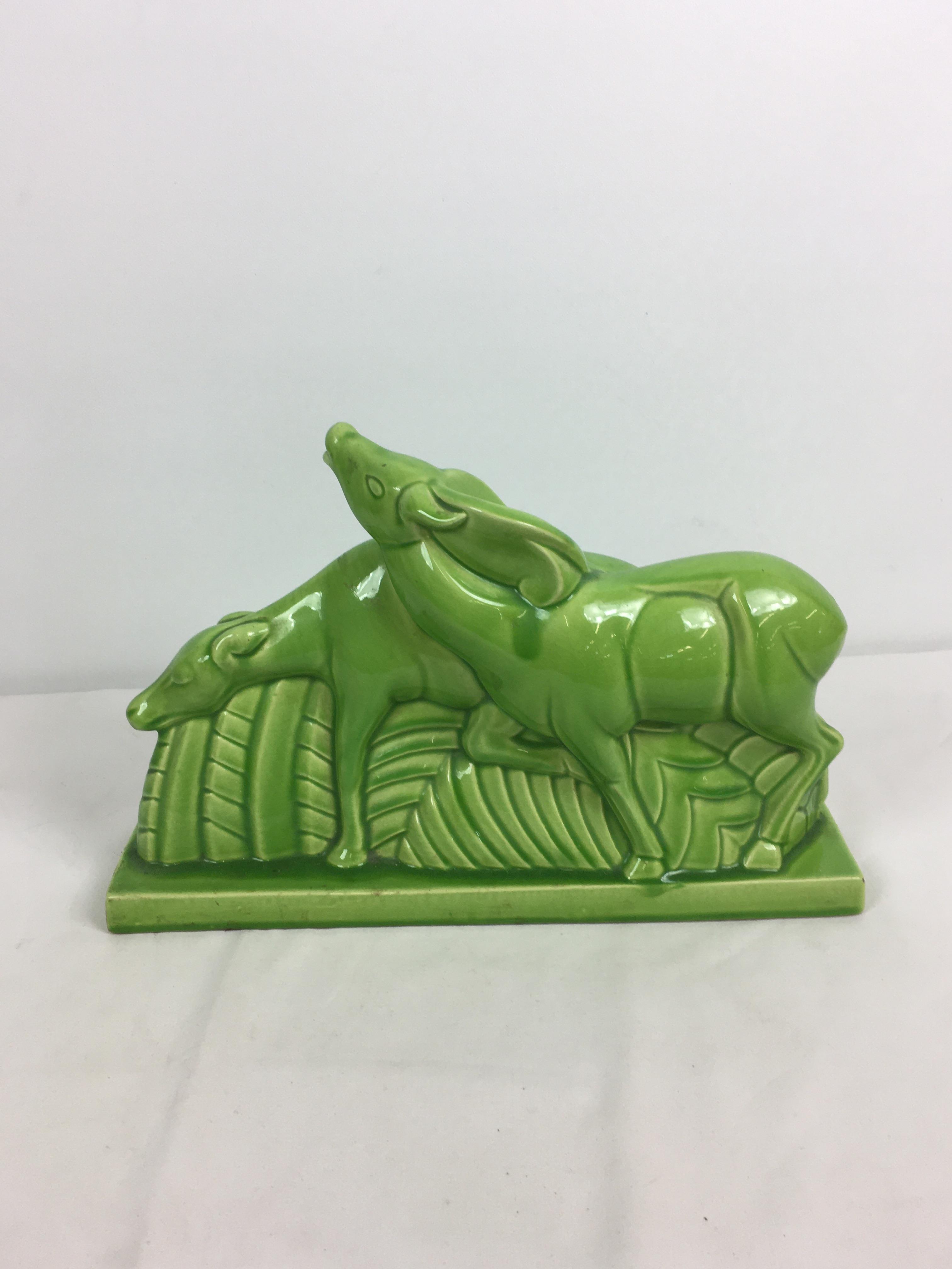 Charles Lemanceau - A French Art Deco green glazed pottery figure group of two stylized buffalo or - Image 7 of 11