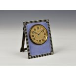An Art Deco period silver and guilloche enamel strut clock, Henry Matthews, Birmingham 1923, the