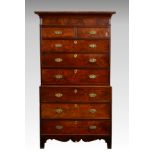 A Regency Channel Islands inlaid mahogany chest on chest, the flared cornice over two short and