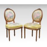 A pair of French 19th century giltwood salon chairs, the balloon backs and stuff over seats