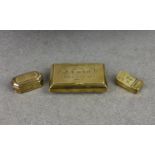 Three antique brass snuff boxes, the largest of rectangular form with convex sides, the hinged cover