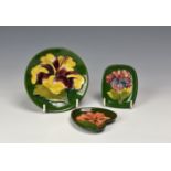 Three modern Moorcroft Pottery trinket / pin trays, decorated with various hibiscus on green