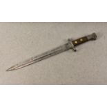 A British 19th century Lee Metford rifle bayonet, the 30cm. double edge blade, marked to ricasso