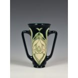 A Moorcroft Pottery twin handled trumpet form 'Snowdrop' pattern vase, Rachel Bishop for Moorcroft