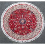 A circular Isfahan style rug, modern, the red ground with central circular medallion and all over