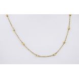 An 18ct yellow gold chain, featuring small golden balls interspersed between 23mm sections of