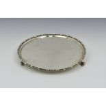 An Edwardian silver salver, Wakely & Wheeler, London, 1904, of circular form with gadrooned rim,