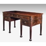 A substantial George III mahogany sideboard in the Adam style, the central drawer above the recess
