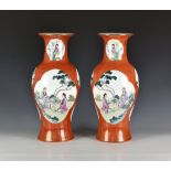 A pair of Chinese Qianlong style porcelain baluster vases, first half 20th century, with red printed