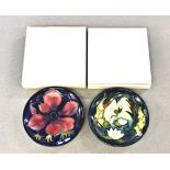 Two modern Moorcroft pin dishes in patterns Lamia and Anemone, 4 5/8in. (11.8cm.) diameter, with