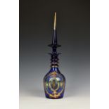 A Bohemian Persian cobalt blue and enamel decanter probably mid 20th century, with triple ring