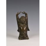 A Chinese bronze buddha figure late 19th century or earlier, standing with hands above his head,