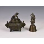 A Chinese bronze covered tripod censer 18th / 19th century, of squat, globular form, with twin