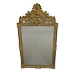 A reproduction 18th century style mirror with pierced foliate cresting. 32¼ x 21½ins (82 x 54.5cm)