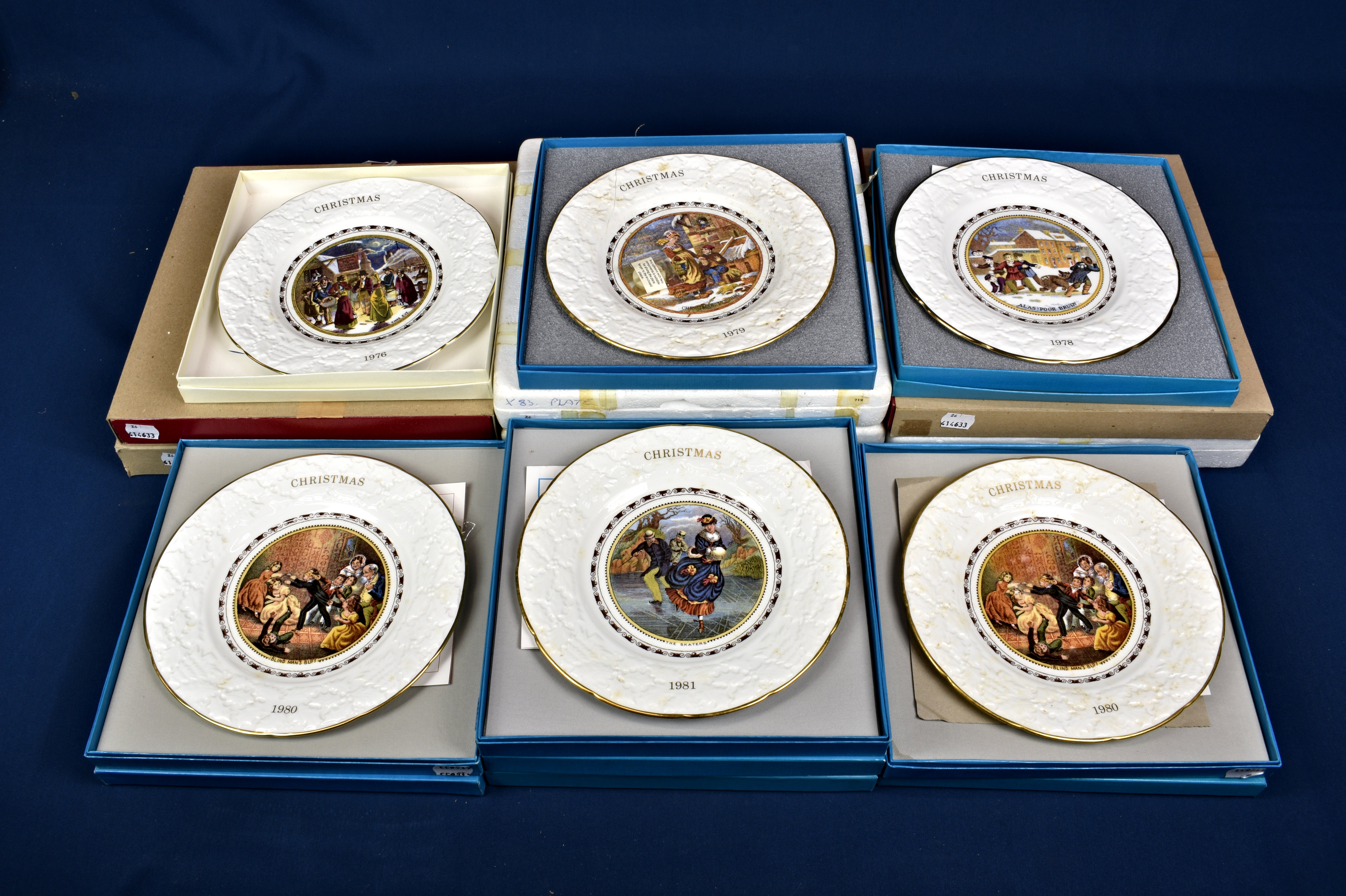 A collection of Christmas cabinet plates to include 10 by Coalport and 6 by Caverswell. All boxed