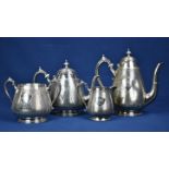 An unusual Victorian silver plate four piece coffee & tea service of pear shape form , the main