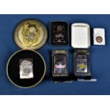 Three Zippo Harley Davidson lighters in the original boxes; together with a Royal Enfield Zippo with