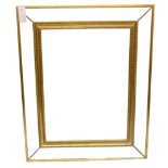 A large contemporary wall mirror with bevelled edge and gilt frame. 106cm x 86cm