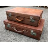 Two graduated vintage brown leather suitcases, both initialled 'E.G.B.'. (2)