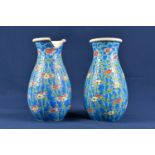 A pair of Japanese earthenware baluster vases early 20th century, profusely decorated with