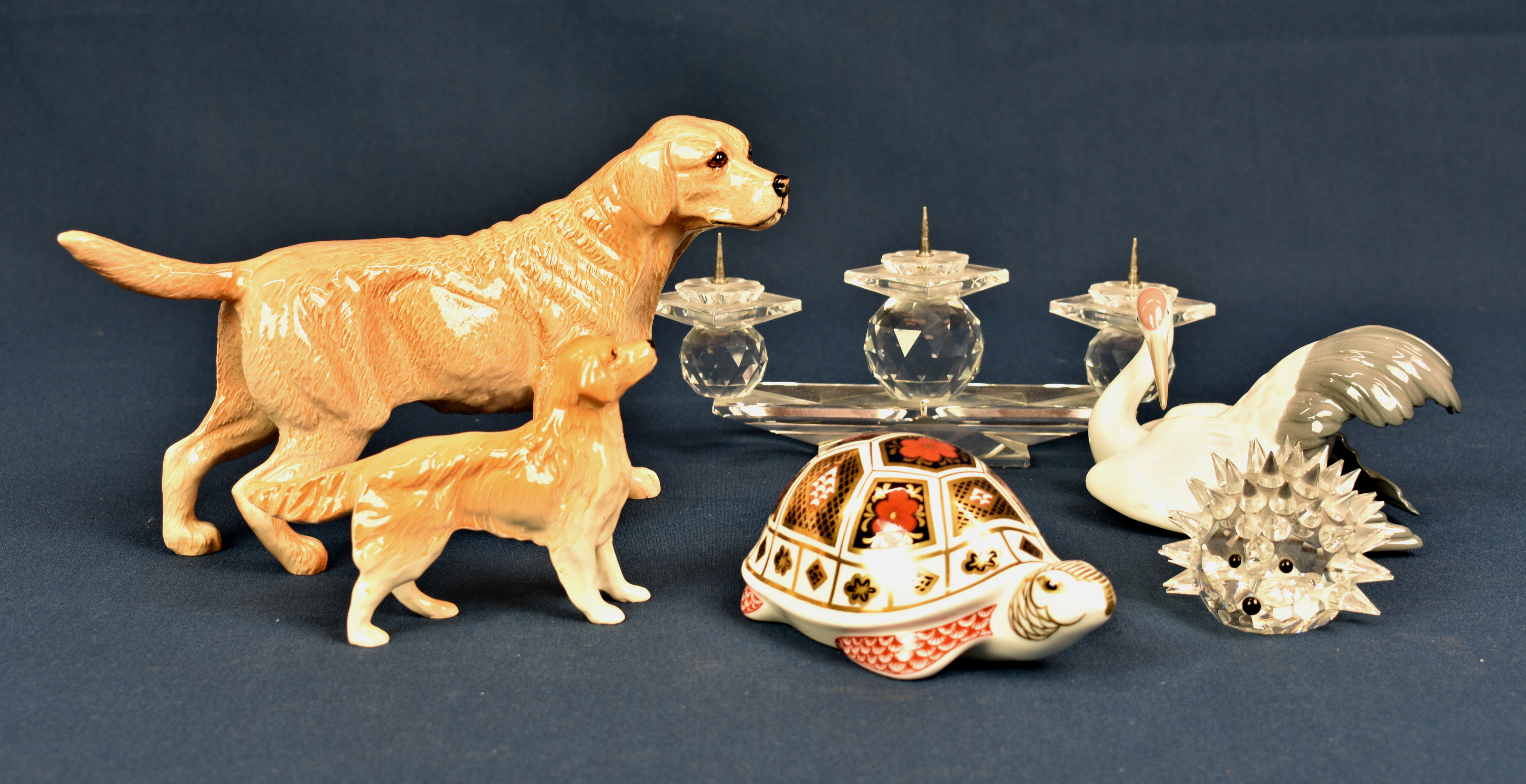 A Royal Crown Derby tortoise paperweight together with a Lladro 1599 crane; a Royal Doulton Golden