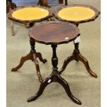 Three pedestal wine tables with pie crust top, two with leather insert. (3)