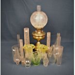 A brass oil lamp with frosted glass shade, 22½in. high together with 14 x clear glass oil lamp