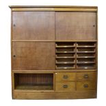 A large oak and pine haberdashery shop cabinet 1940s-50s, a 'Patent "Kwikserving" Fixtures'