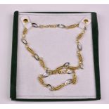 A pretty Italian 14k white and yellow gold necklace and bracelet set - gross weight 16.4g.