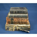 Four various antique leather bound Bibles.