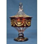 A Victorian ruby flash covered vase with gilt decoration.