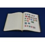 A stamp album of Commonwealth and World stamps Queen Victoria & onwards, to include a Penny Black (