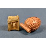 A novelty carved wood thimble case with Stanhope fashioned as a walnut the walnut sitting on a