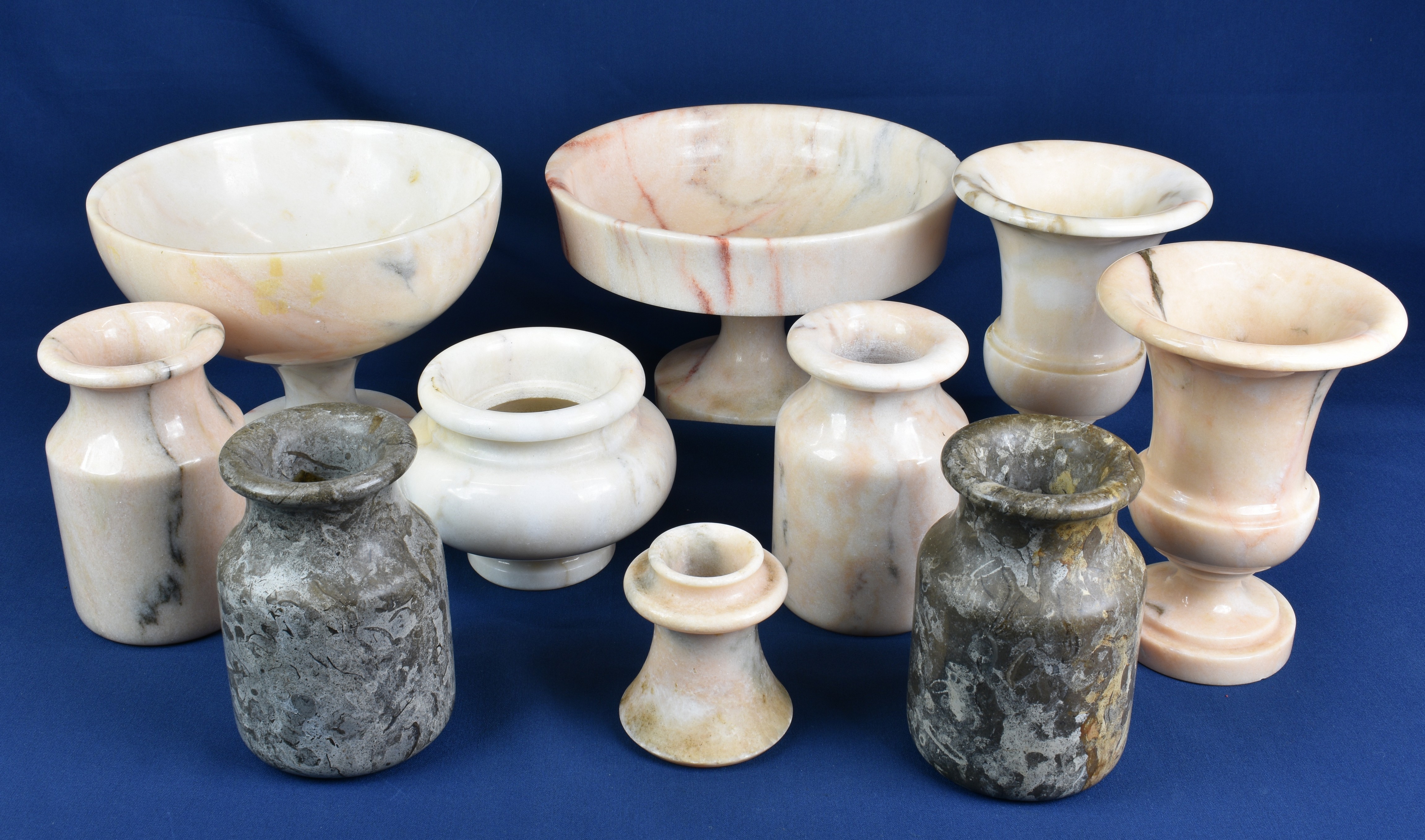 A collection of Portugese carved marble vases and urns. (5)