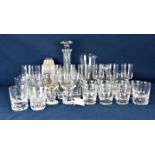 A large collection of various glassware comprising a set of tumblers and jug with cut wheat