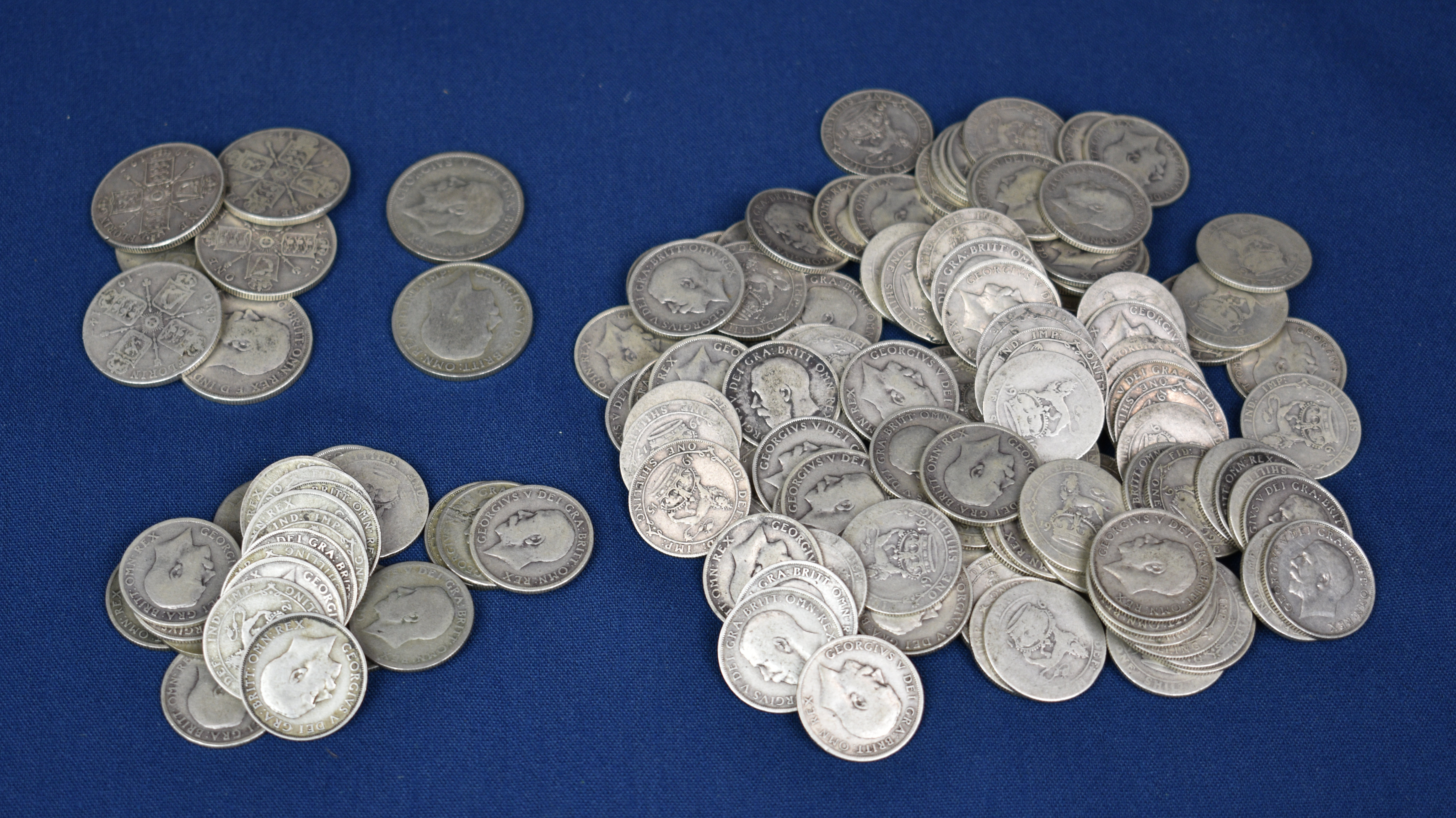 A collection of silver coinage - George V One Shillings and One Florin comprising of 117 - 1911-1919