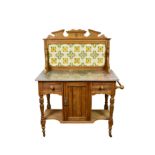 A Victorian waxed pine and marble wash stand with tiled back