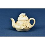 A miniature Derby porcelain teapot Stephenson & Hancock, c1862, heavily encrusted with flowers, 2½