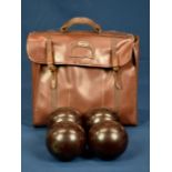 A set of four Henselite Super Grip lawn bowls size 3 146 LG, in leather Slazenger case.